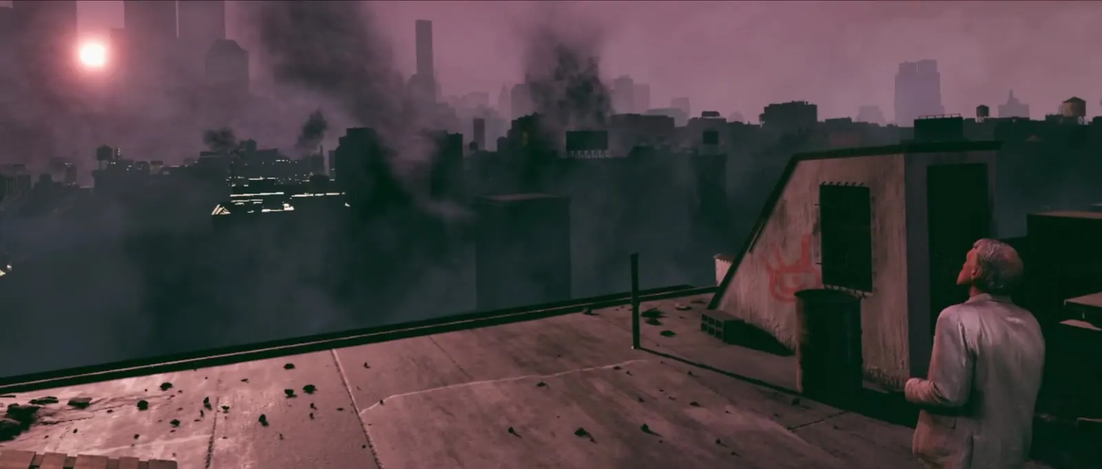 A man on a rooftop facing a pink city